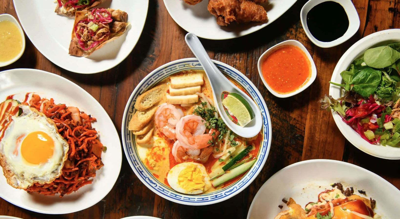 Today’s hawker centers mix heritage, speed, and city rhythm into bowls that feel both familiar and brand new